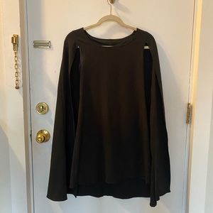 Vintage little black dress with attached cape. Size unknown. I’d assume an XS.